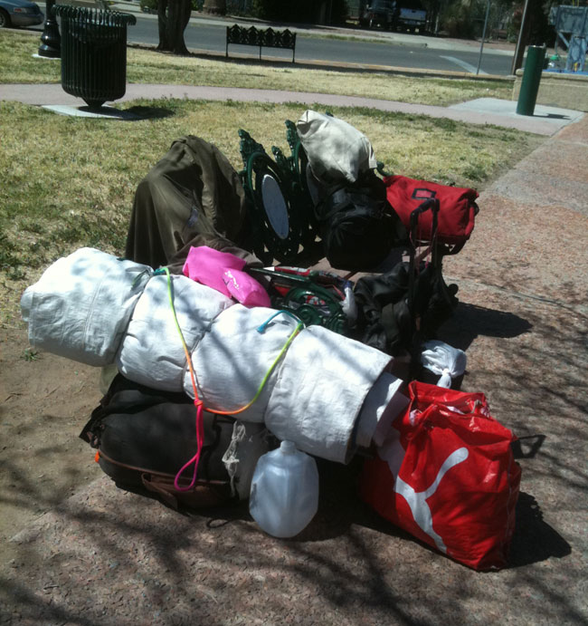 A homeless' belongings set on a park bench at Sunset Heights, El Paso. (Lourdes Cueva Chacón/Borderzine.com)