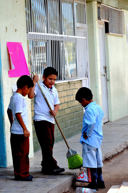 Kids are in charge of sweeping and mopping the classroom. (George Thomson)
