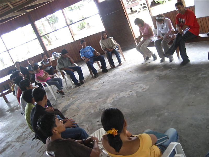 Lucia Dura and Arvind Singhal (far right) conducting a focus group in an Amazonian village. (Courtesy of Lucia Dura)
