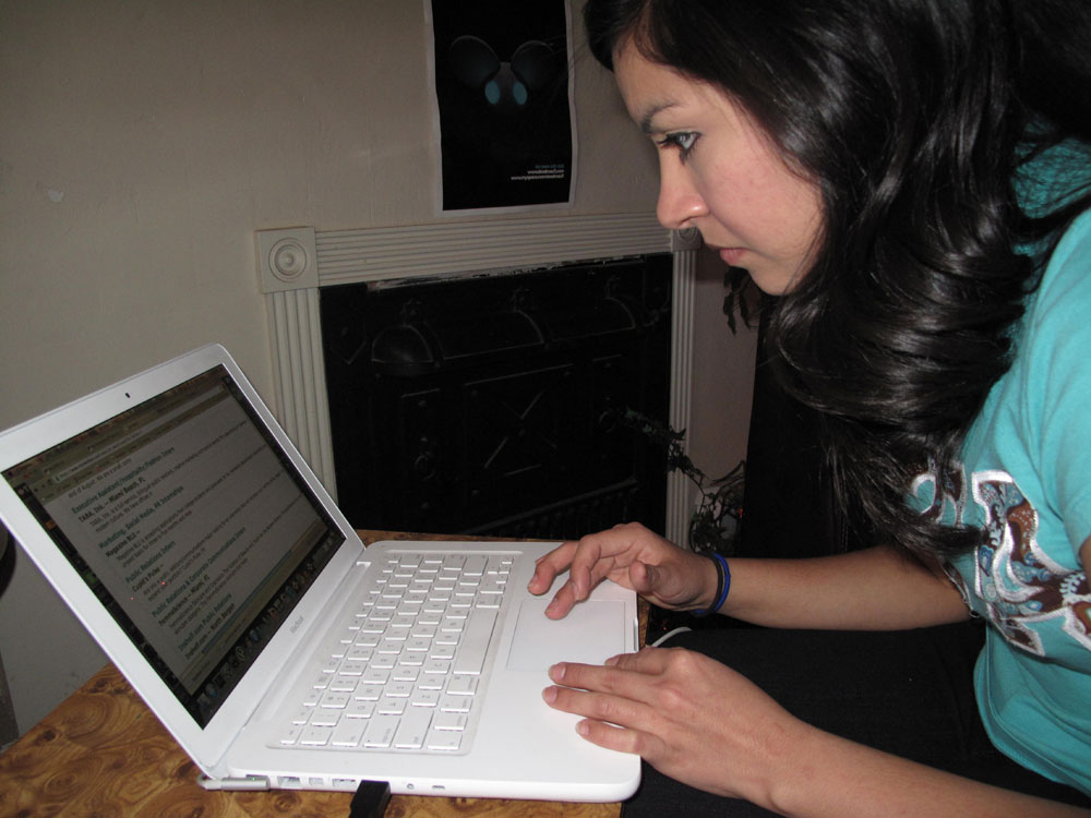Elizabeth Estrada, December 2010 graduate, Bachelors in Organizational and Corporate Communication, looks for a job on UTEP's Jobmine website.