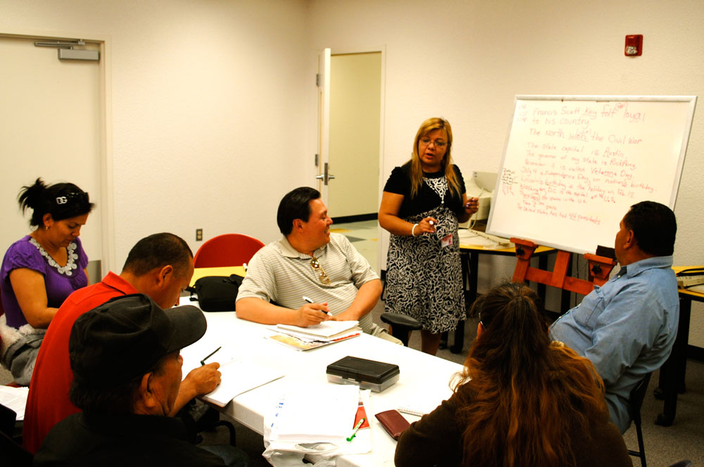 Josefina Campos, ESOL and Citizenship Class Coordinator at La Fe's Cultural Technology Center teaches exam material to her daily citizenship course. (Omar Lozano/Borderzine.com)