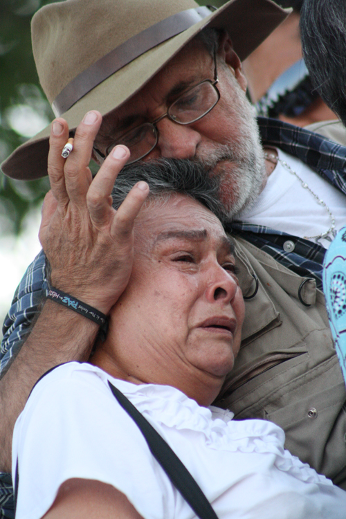 Javier Sicilia comforts Luz María Dávila at the really in Juarez on June 10. Dávila had two sons killed in Villas de Salvacar. (Luis P. Hernández/Borderzine.com))