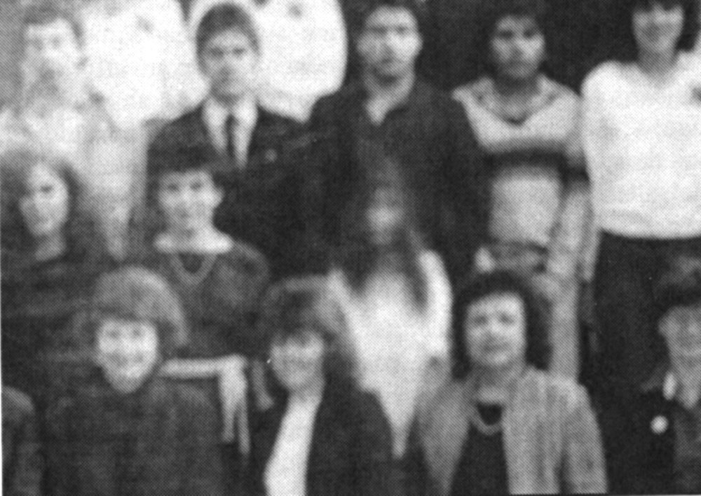 1986 Graduating class - The girl on white was not in the original negative but is in the developed photo. No one knows who she is. (From the El Paso High public pictures)