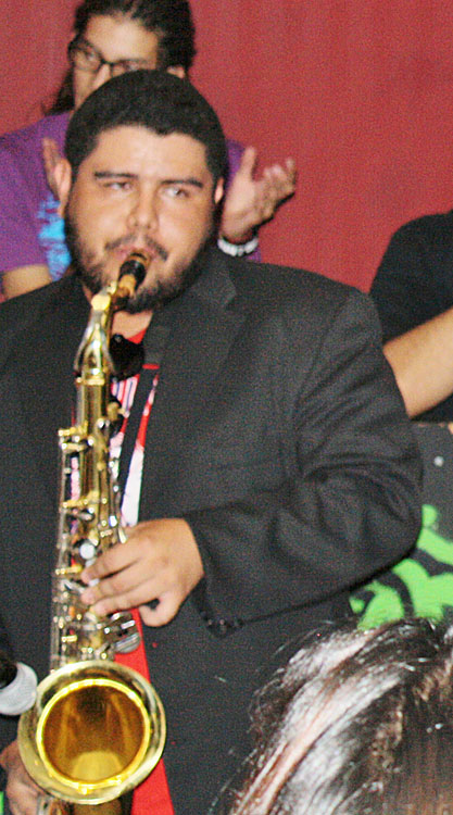 Richie David Marrufo, UTEP alumnus, PLAYING his saxophone. (Cheryl Howard/Borderzine.com)
