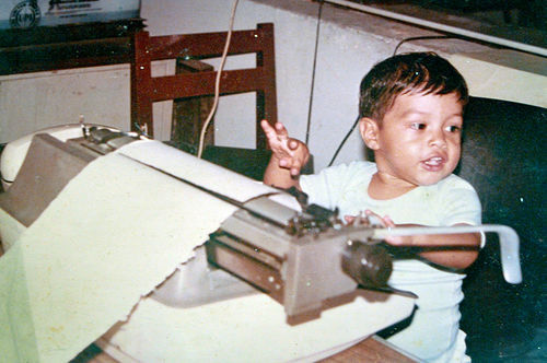 Family photo of Miguel Angel Lopez Solana, about 2 years old, sitting at the Telex machine in his father's office at Notiver. (©Miguel Angel Lopez Velasco)