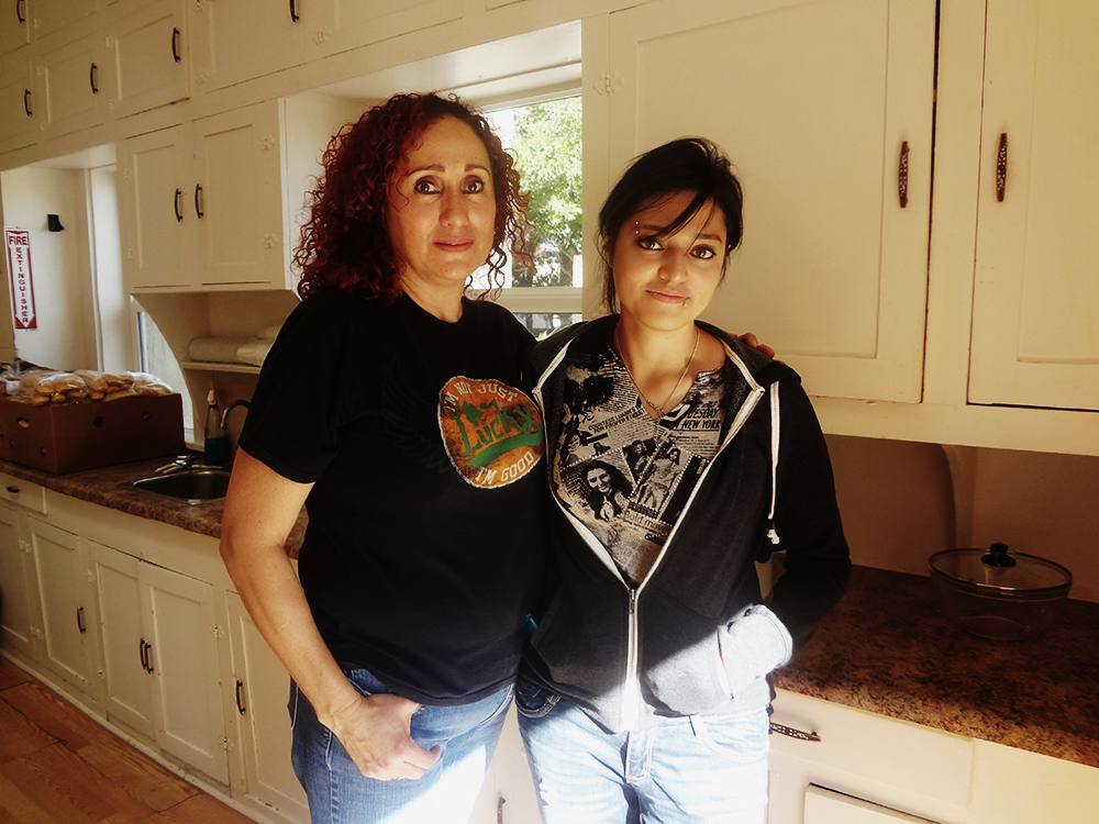 Ivette and her mother, former residents of Reynolds Home, now come to help as volunteers. (Nadia Garcia/Borderzine.com)