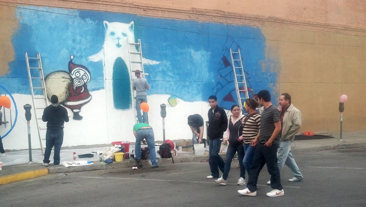 The Urban Art-Fitters League of El Paso working on "Winter wonderland" at Fourth St. (Iris Lopez/Borderzine.com)