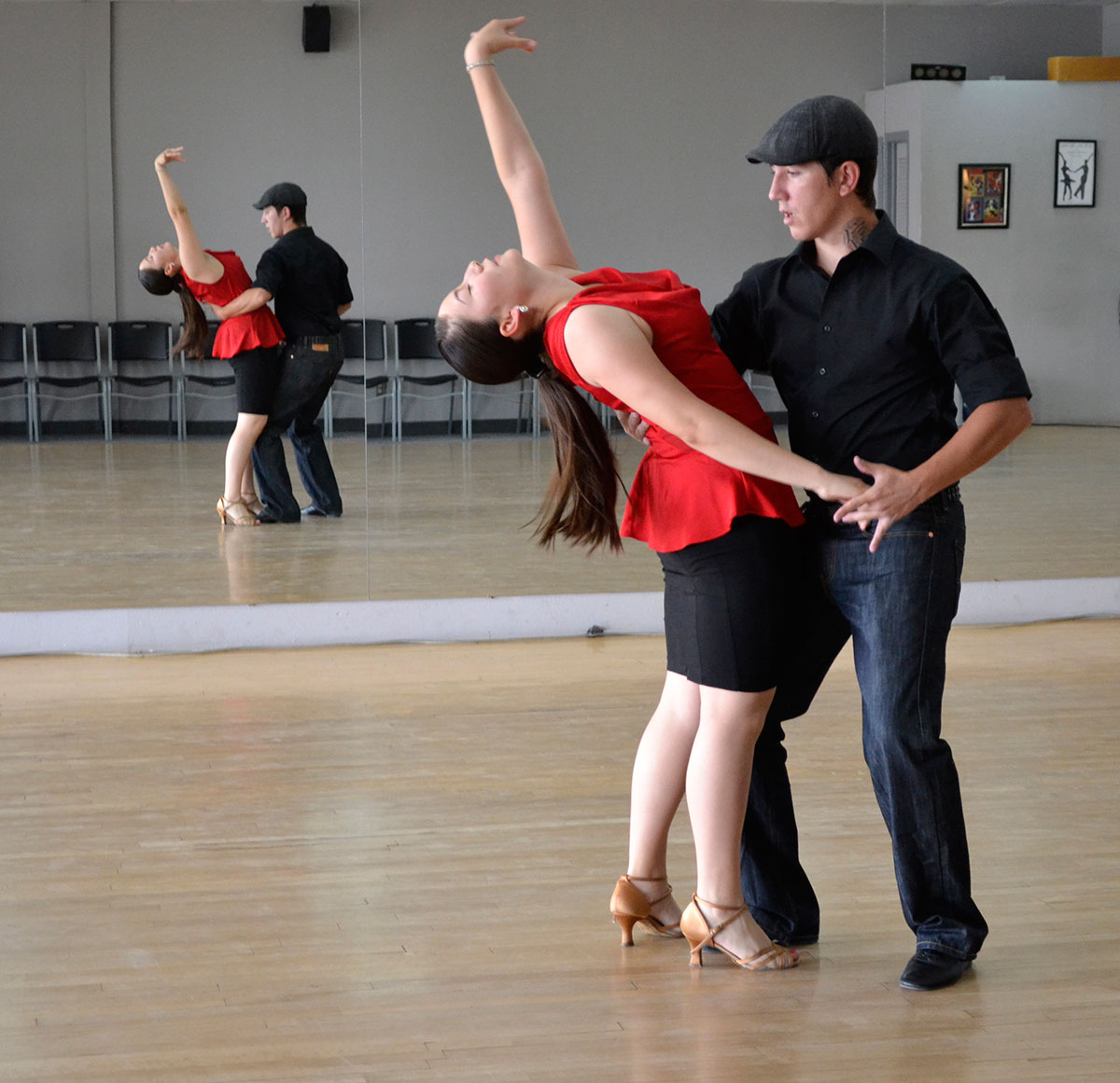 Instructor Stan Huber and student Alyssa Garcia at ballroom practice. (Kimberly Garcia/Borderzine.com)