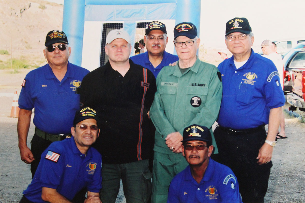 Miguel Fernandez (center) with members of the Vietnam Veterans of America Wieland C. Norris Chapter 844. (David A. Reyes/Borderzine.com)