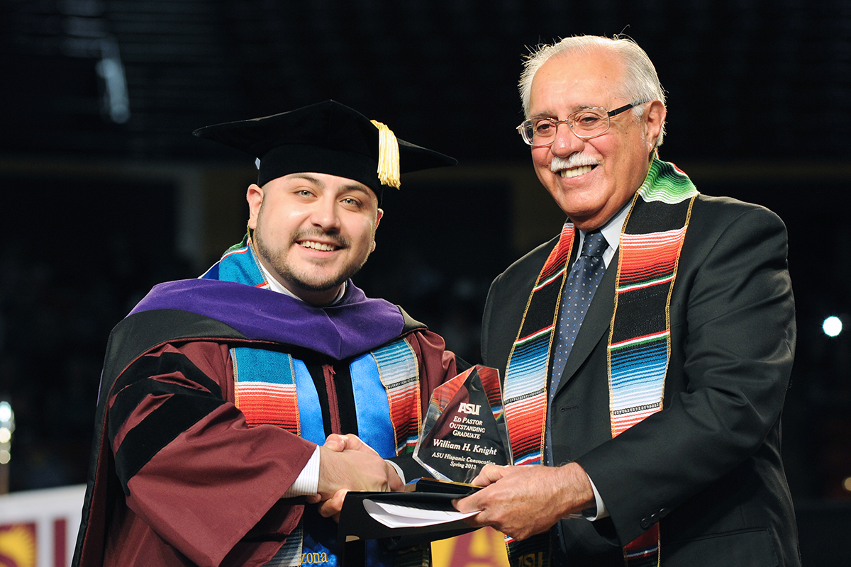 Graduating Latino student, William Knight receiving an award at ASU's ceremony. (Tim Trumble/Hispanic Link)