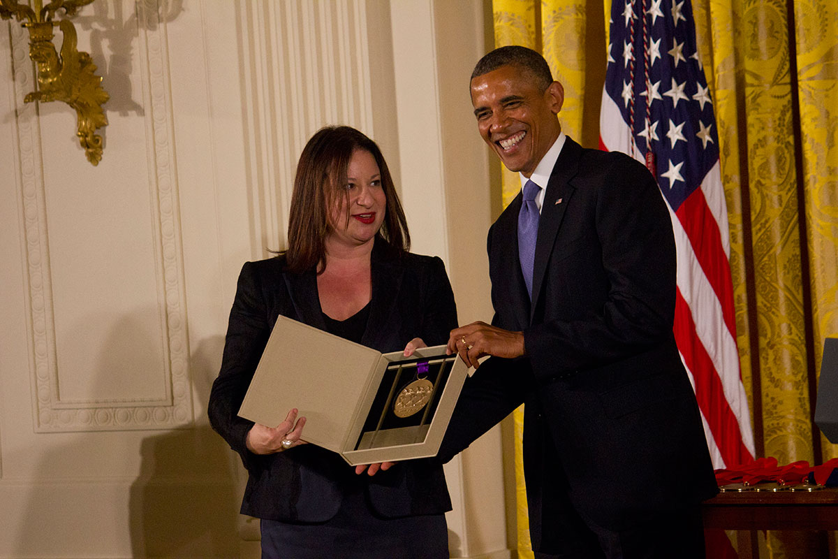 President Barack Obama awards the National Medal of the Arts to Jenny Bilfield, president of the Washington Performing Arts Society. She accepted the award on behalf of her organization. (Caleigh Bourgeois/SHFWire)
