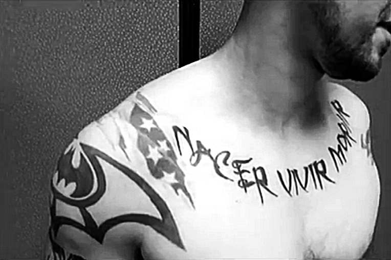 Veteran Victor Garcia displays his tattoo Nacer Vivir Morir. " Your born, you live, and you die" he says. (Cristina Quinones/Borderzine.com)