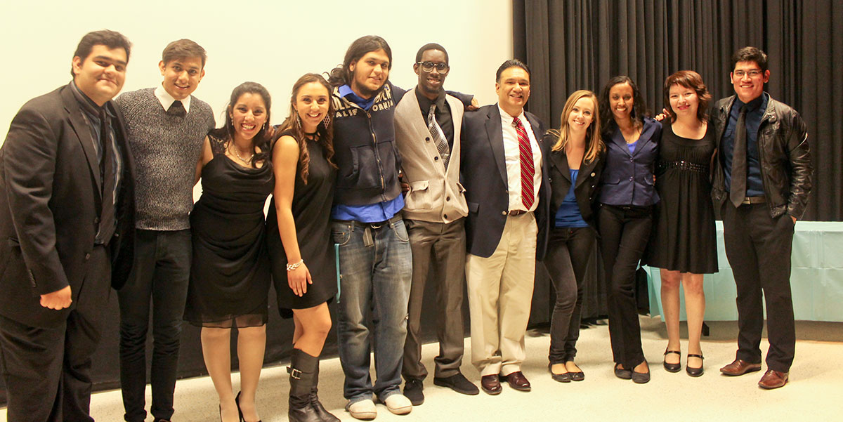 Bobby Gutierrez (red tie), senior lecturer at the Communication Department, with committee members and filmmakers at La Estrella inaugural launch. (April Lopez/Borderzine.com)
