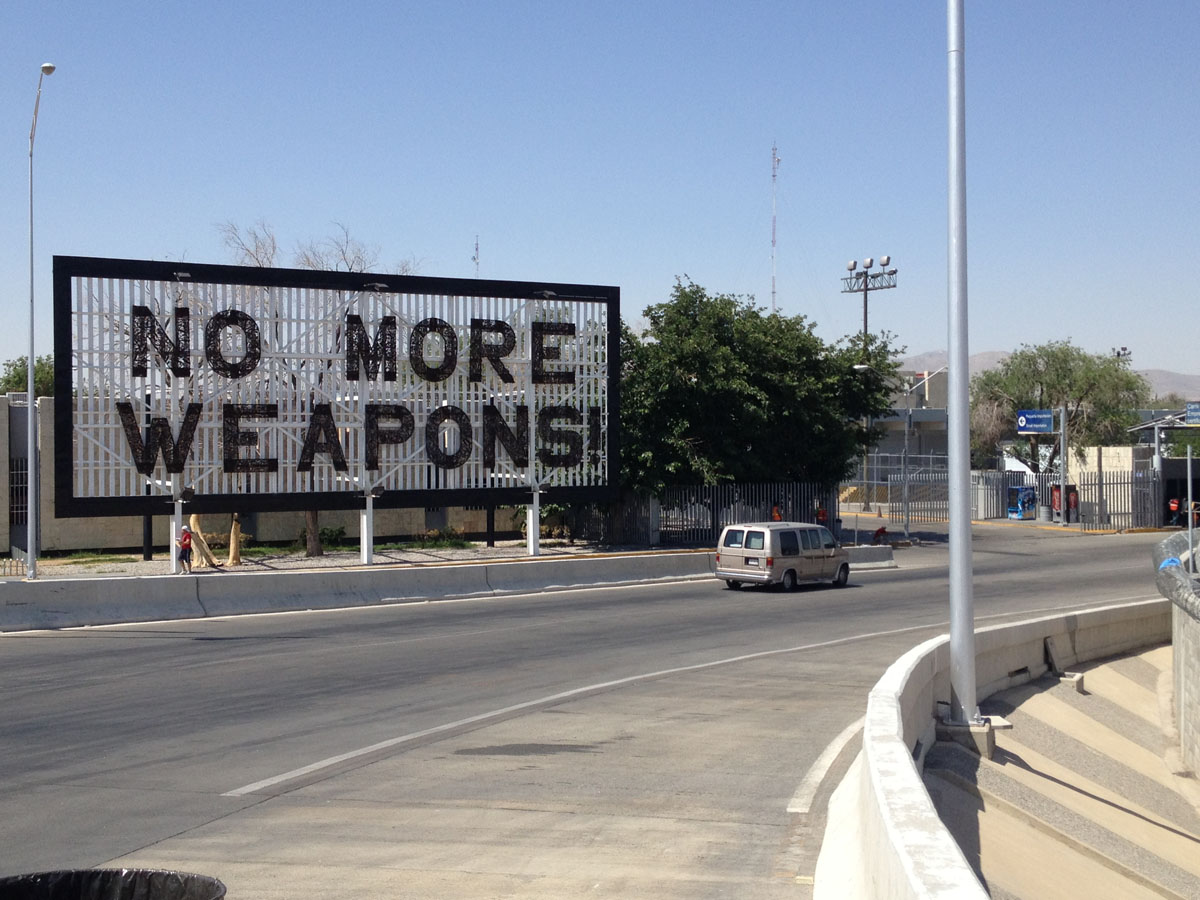 Former Mexican President Felipe Calderon placed a "No More Weapons" sign at the foot of the Bridge of the Americas. (Sergio Chapa/Borderzine.com)