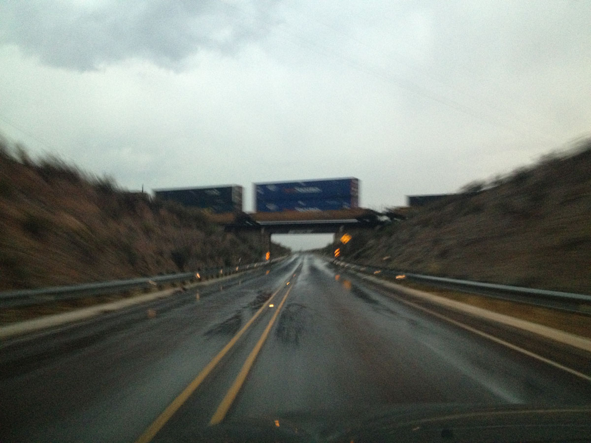 Rain and rail road crossing along Highway 90. (Sergio Chapa/Borderzine.com)