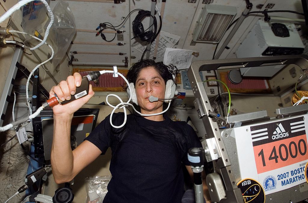 Astronaut Sunita Williams, Expedition 14 flight engineer, circled Earth almost three times as she participated in the Boston Marathon from space. She is seen here with her feet off the station treadmill on which she ultimately ran about six miles per hour while flying more than five miles each second. (NASA)