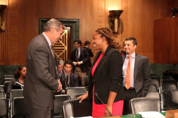 Sen. Jeff Merkley, D-Ore., left, Heather McGee and Amir Sufi talk last week after a Senate hearing on income inequality. McGhee said addressing inequality is the key to unlocking policy changes that the working middle class supports. SHFWire photo by Rocky Asutsa