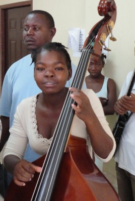 Bass student at  Occide Jeanty Music Academy in Cité Soleil, Haiti.