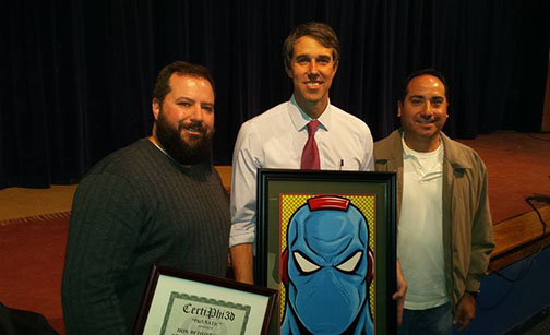Phi3 Comics co-creators Matthew Rothblatt and Ben Perez present Congressman Beto O'Rourke a certificate and photo print of Spiralmind