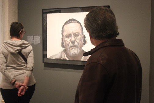 Visitors at the Smithsonians National Portrait Gallery look at Gaspar Enriquezs John portrait. Enriquez and 42 other artists works were chosen from 2,500 submissions for the portrait competition that is held every three years. SHFWire photo by Luis Gonzalez