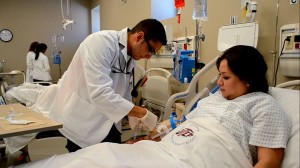Jason Garcia, fifth semester student, practices simulating how to do an IV. (Jorge Castanon/Borderzine.com)