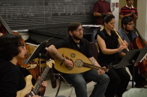 Senior Jecoa Ross plays the oud along with other students during Layali Al-Sham’s rehearsal. (Paul Reynoso/Borderzine.com)