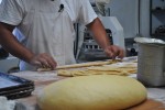 A baker prepares dough for Simones (Cinnamon rolls). (Pablo Hernandez-Batista/Borderzine.com)