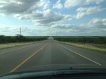 The bleak highway between Laredo and Eagle Pass is filled with shrub buses, natural gas well and oil wells. (Sergio Chapa/Borderzine.com)