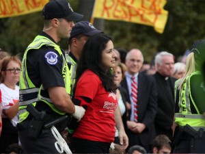 Brenda Perez of Nashville, Tenn. is arrested on First Street after protesters marched to the Capitol Tuesday. Perez was part of a group of three activists from Workers Dignity from Nashville who were arrested for civil disobedience. (Andrés Rodríguez/SHFWire)