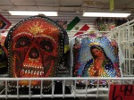 Baseball cap of the Virgen de Guadalupe sold alongside one of a skull in downtown Laredo, Texas. (Sergio Chapa/Borderzine.com)