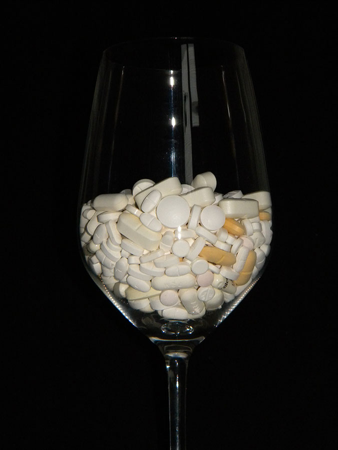 pill and tablets in a glass