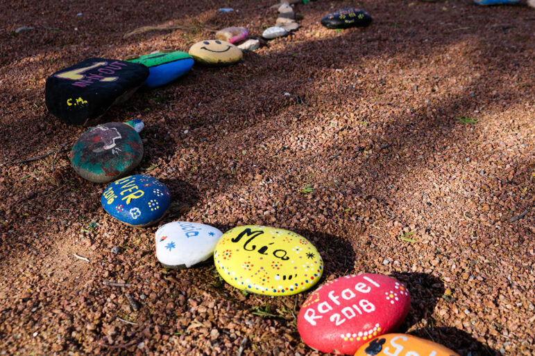 Decorated rocks lined up in the park at the Don Haskins Recreational Facility in El Paso.