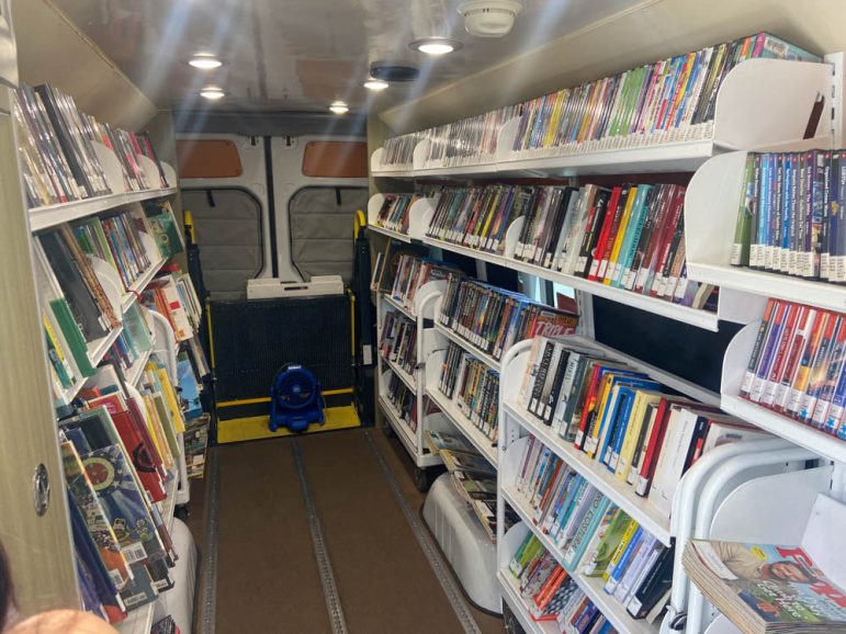 Inside the El Paso BookMobile. The van stops throughout the El Paso area encouraging people to check out books.