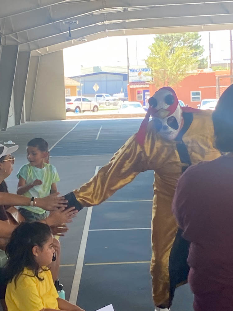 Luchador, "Kung Fu Panda" ran around the crowd to rally the crowd at the Chamizal Community Center after being announced after his competitor.